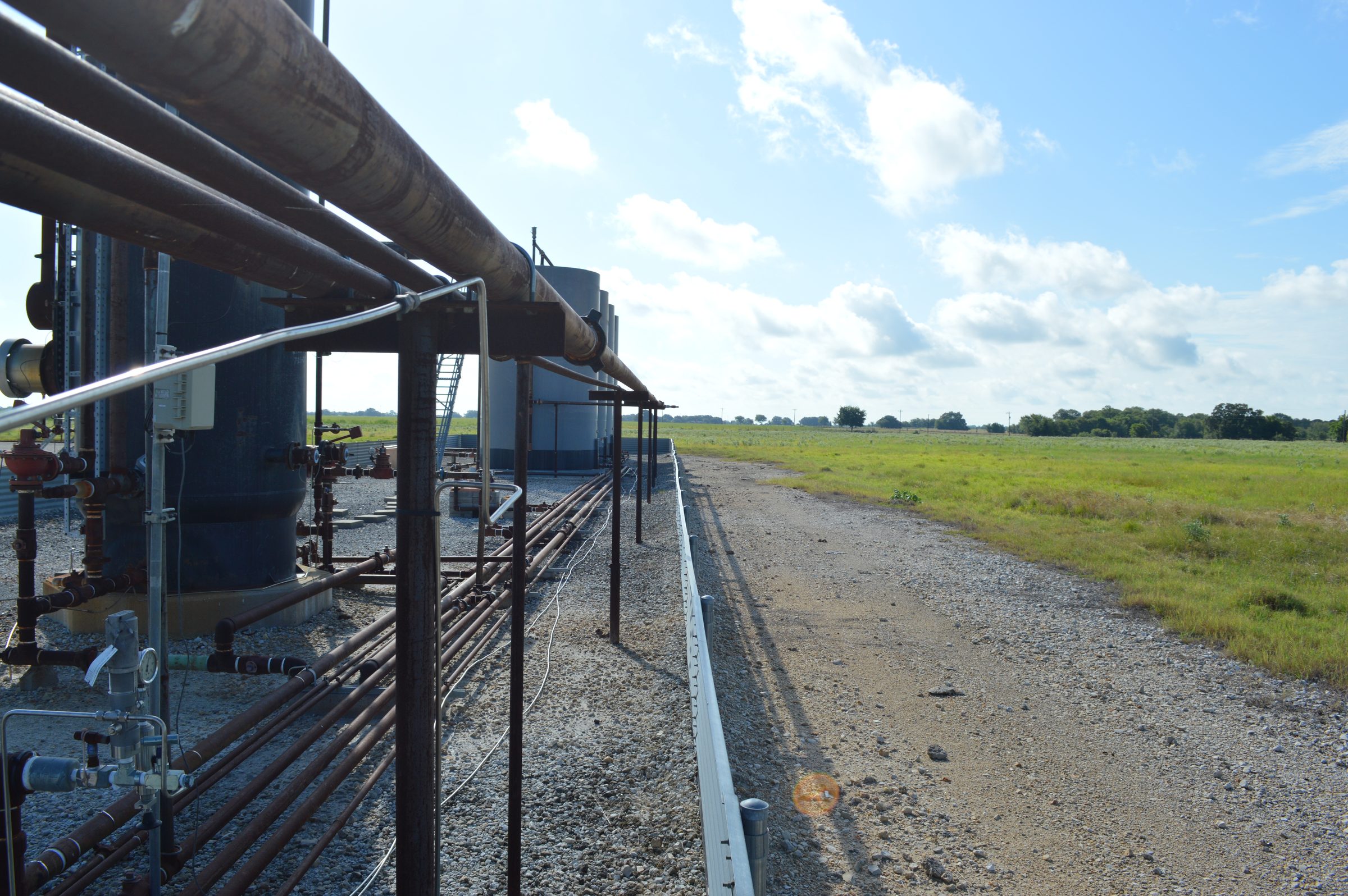 Tank battery and header piping at a Texas facility